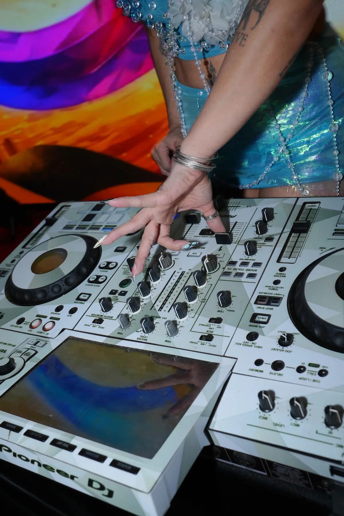 DJ hands on the mixer during the after-party