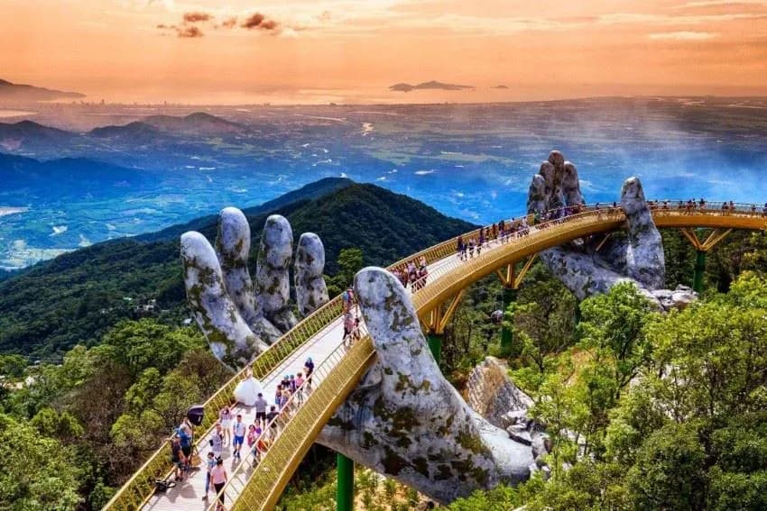 The Golden Bridge held up by two giant stone hands on Ba Na Hills