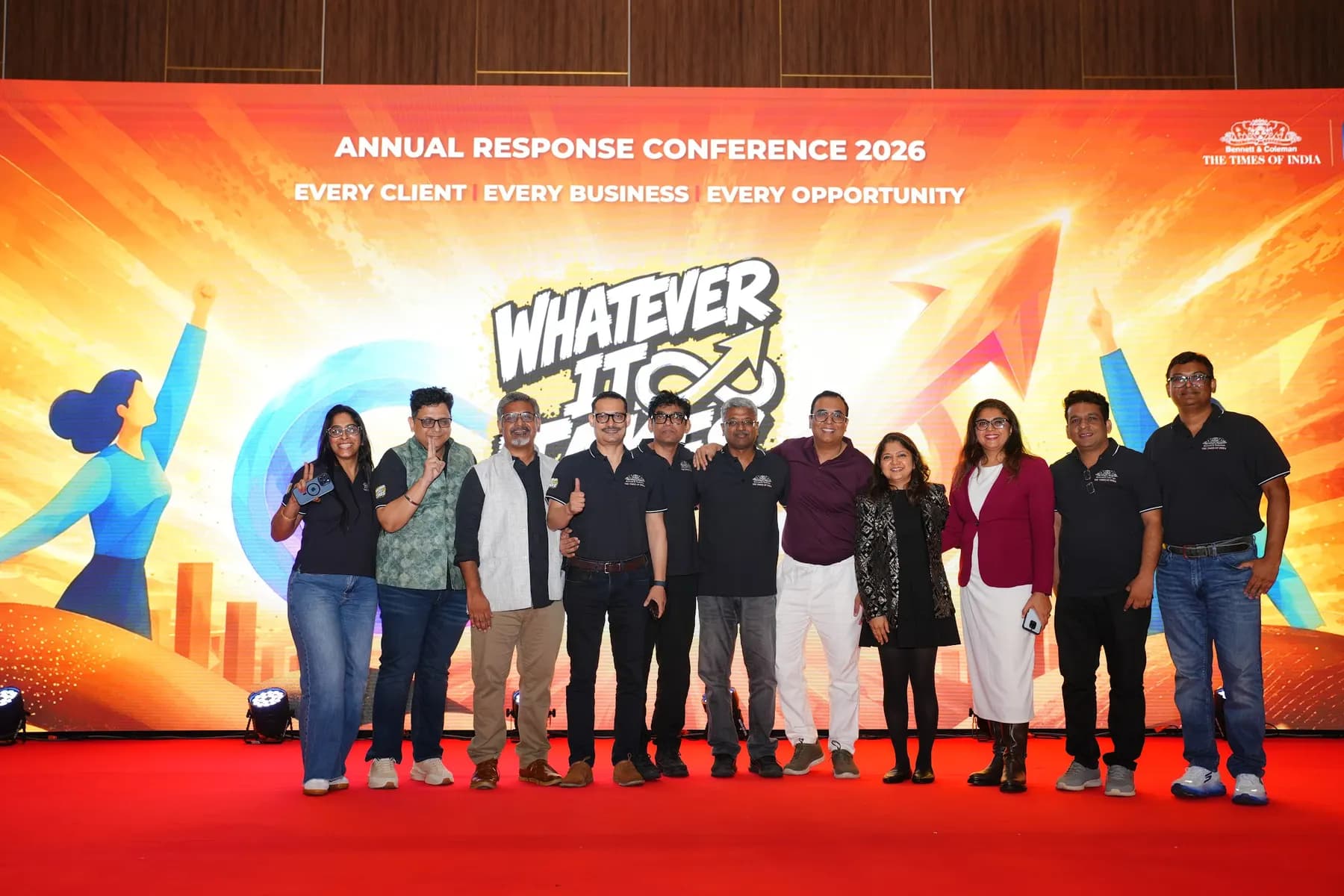 Group photo on stage in front of the LED backdrop
