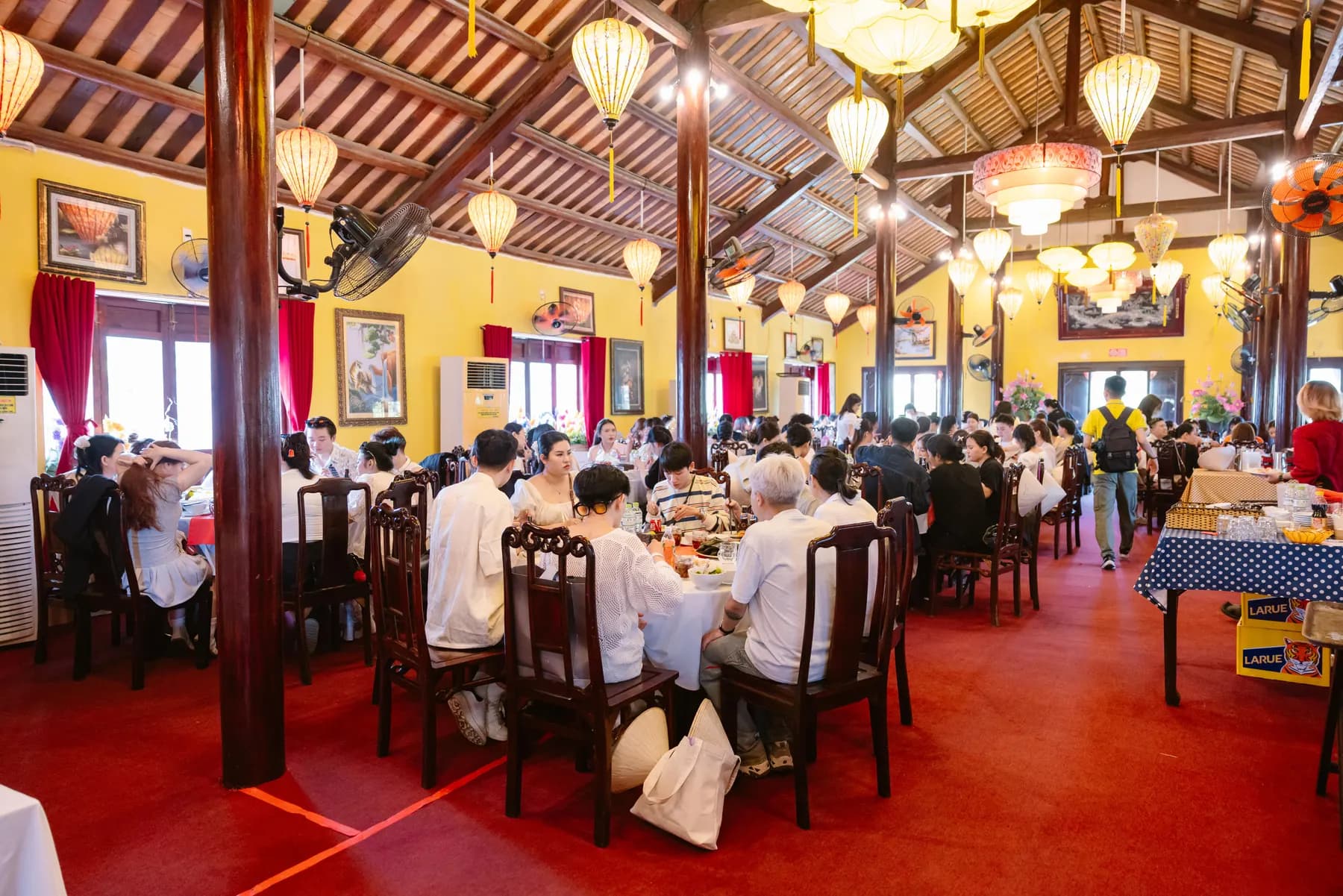Group lunch in a lantern-lit restaurant in Hoi An