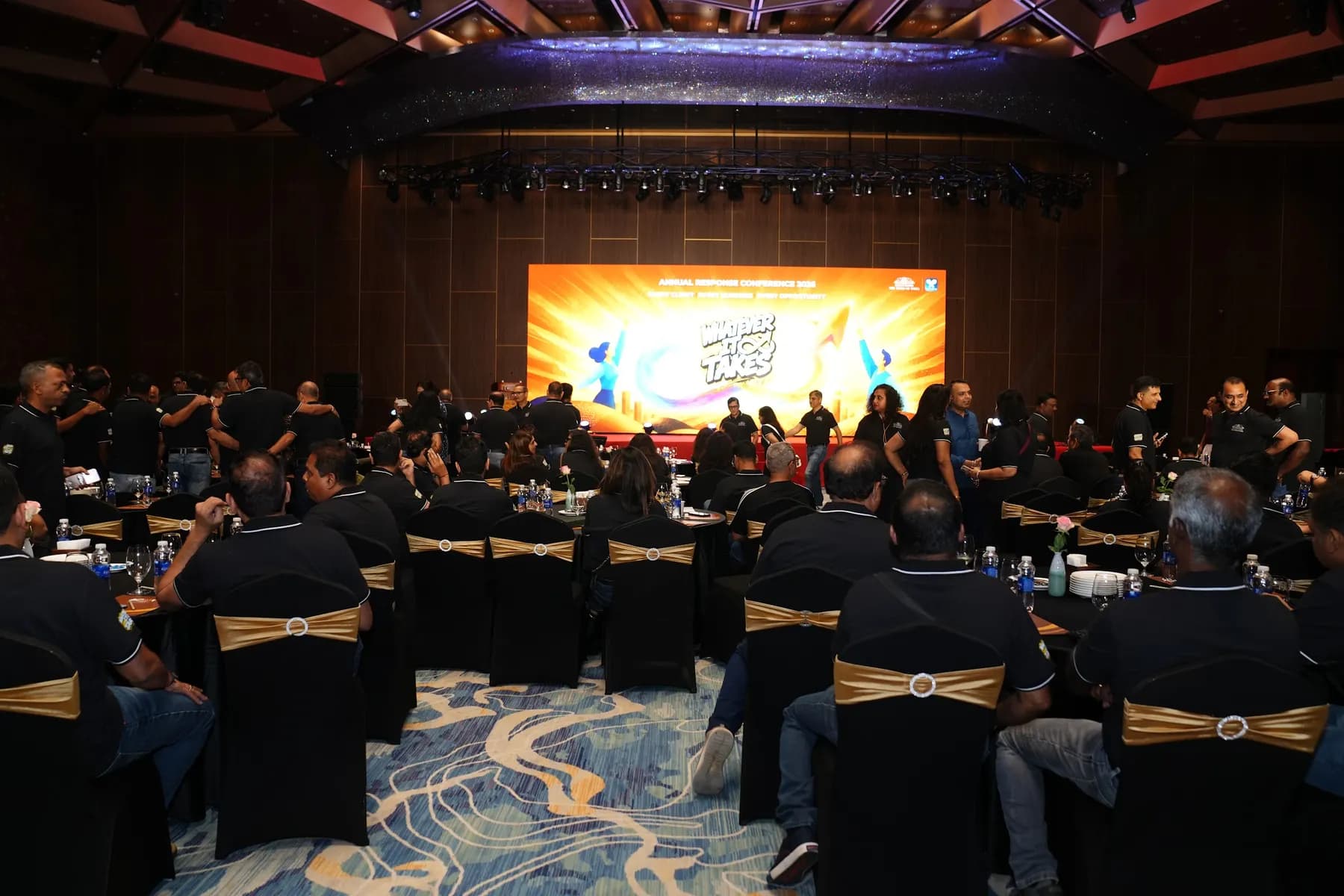 Ballroom seen from the back with the lighting truss over the LED stage