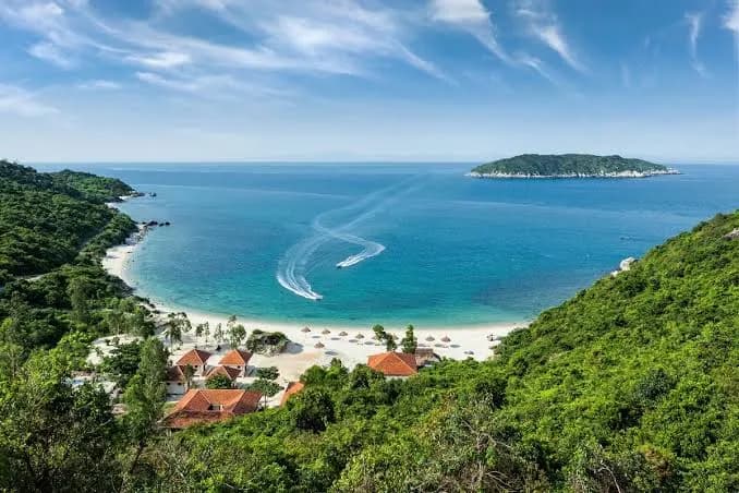 Green hills and a white sand cove on Cu Lao Cham island