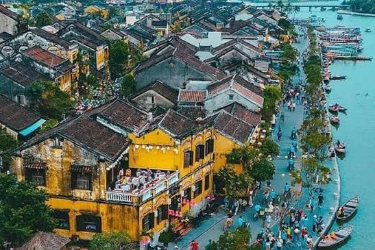 Yellow houses of Hoi An old town along the Hoai river from above