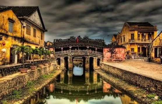 The Japanese Covered Bridge in Hoi An reflected in the water