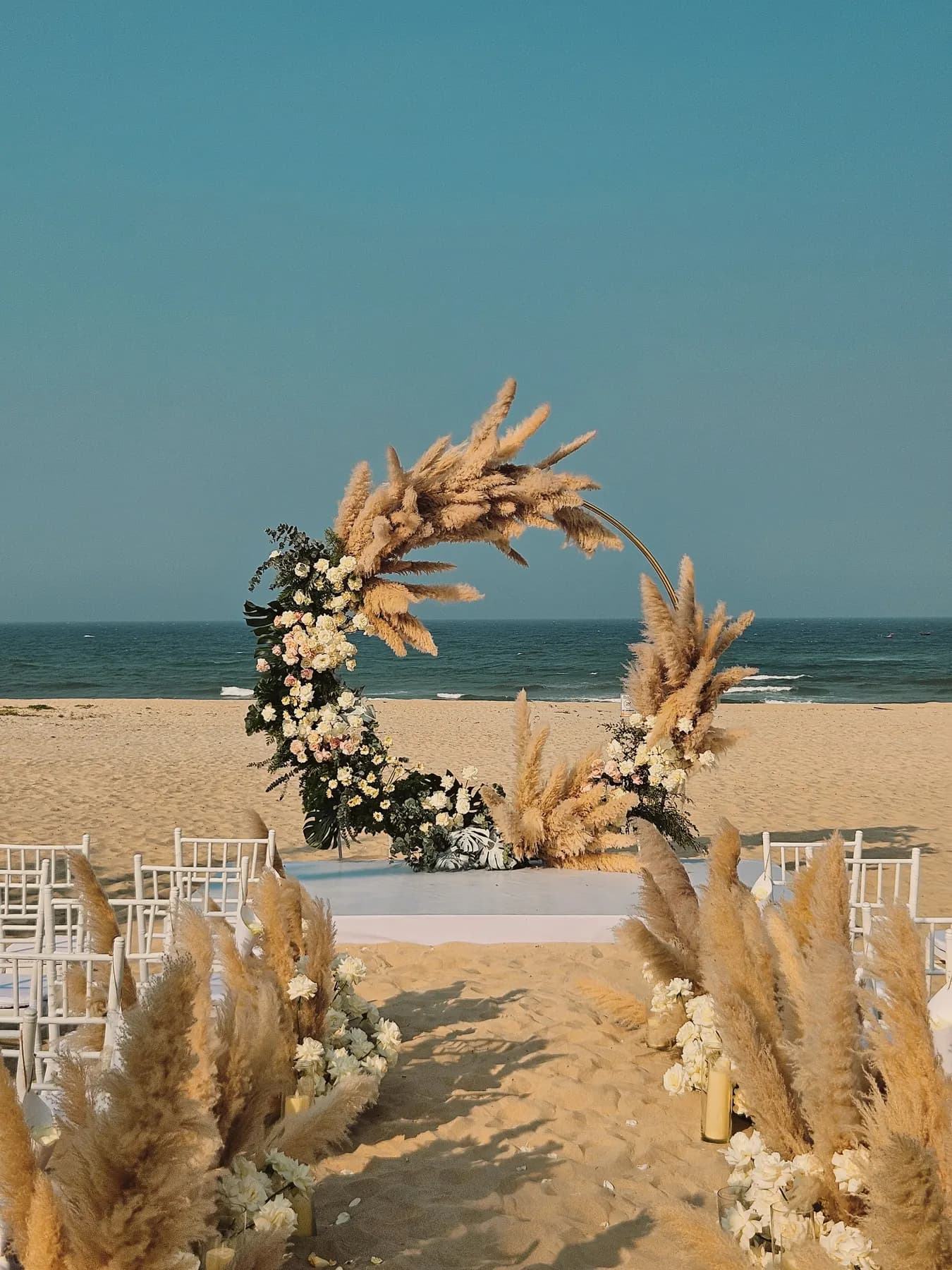 Pampas grass arch on the sand
